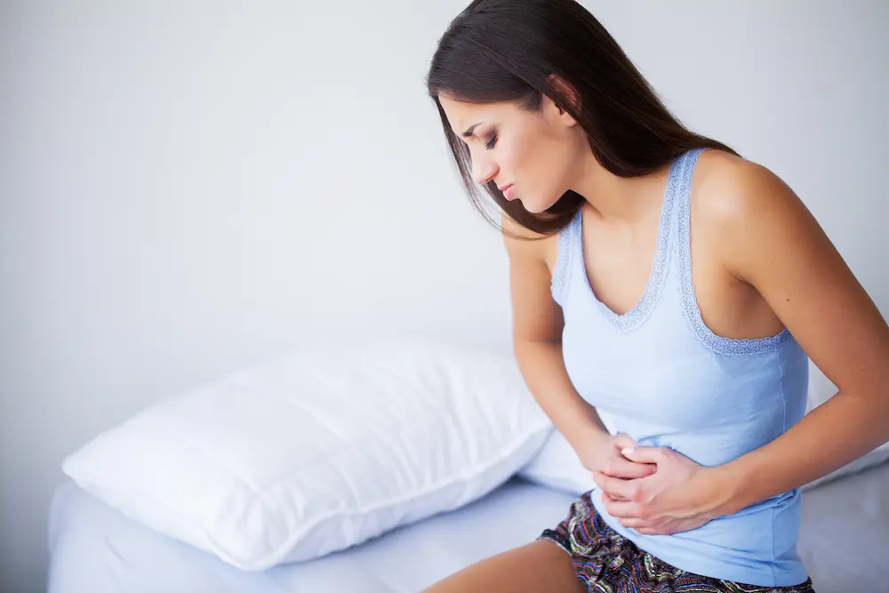 Douleur aine nidation : comprendre ce symptôme précoce - May App Santé